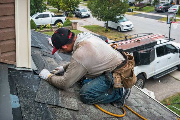 Professional Roof Replacement technician working in Oxford, MA